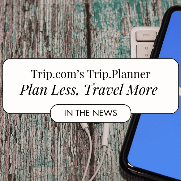 Trip.com showing on cellphone with earphones by the side