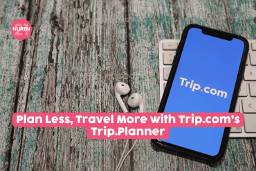 Trip.com showing on cellphone with earphones by the side