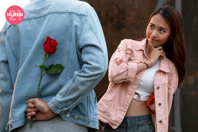 man holding rose looking to surprise girlfriend