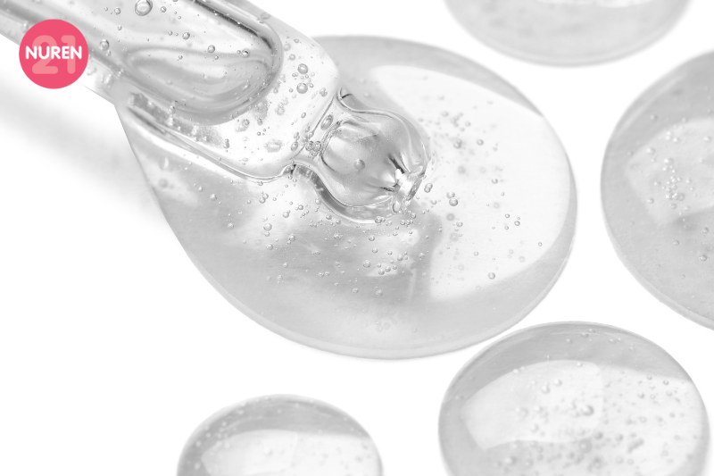 image of dollop of serum on clear glass showcasing its molecules clear colour see through