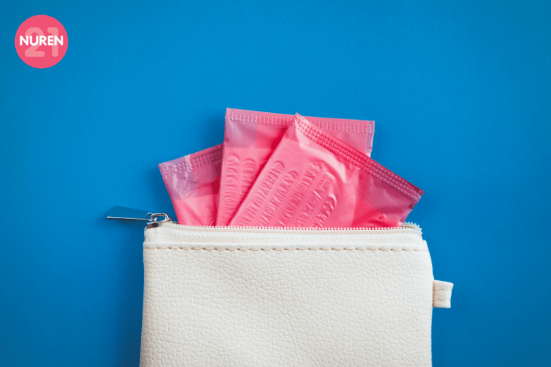 image of pouch with extra sanitary pads for emergency faltlay on blue background