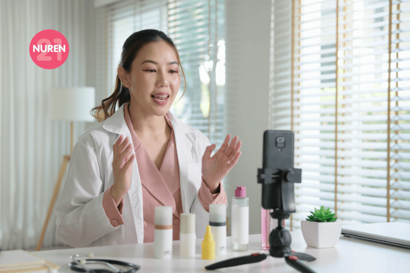 woman sitting in front of phone camera with products for review