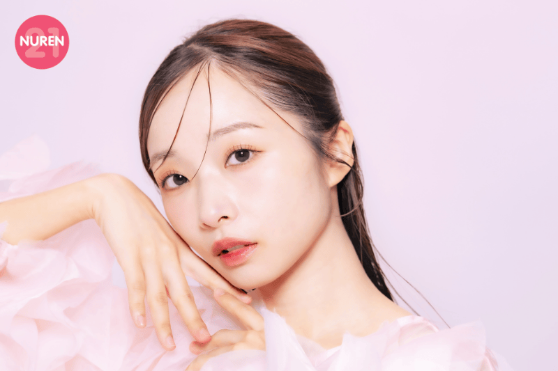 image of woman with light pinkish make up set in a pink isolated background
