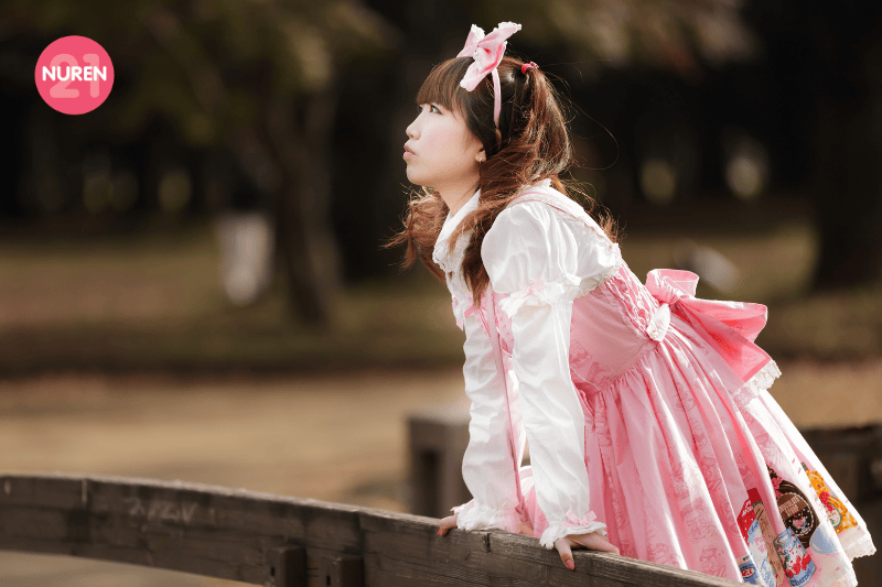 A cute lolita girl looking out from a bridge