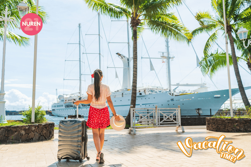 A tourist with luggage about to board the ship