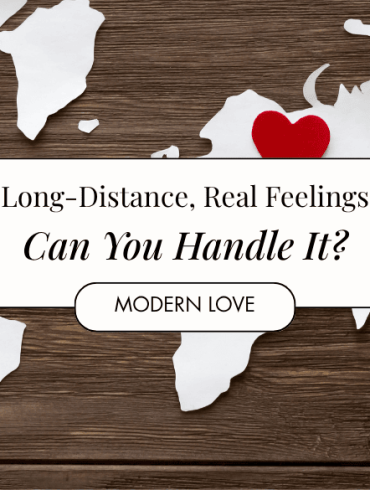 Red felt hearts and world map cut from white paper on the wooden background