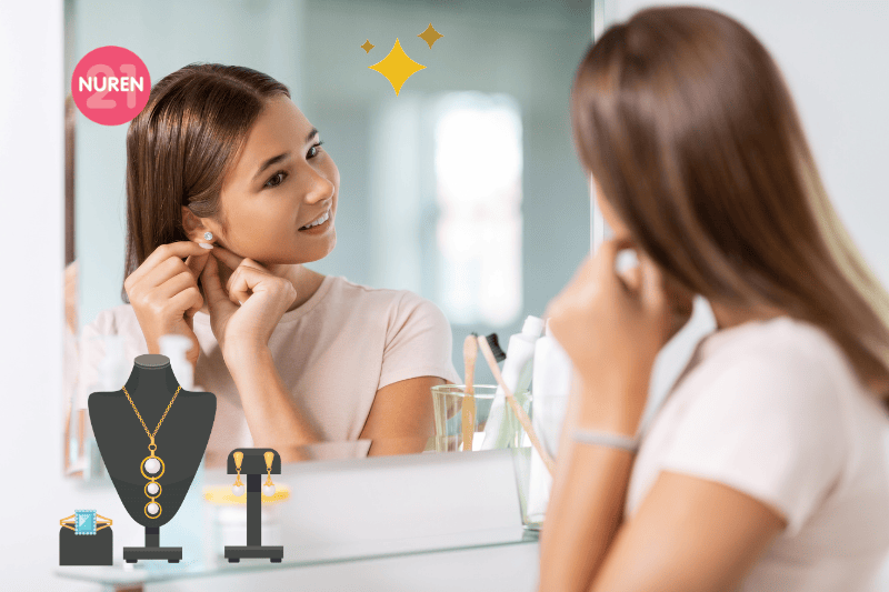 A woman putting on her earrings
