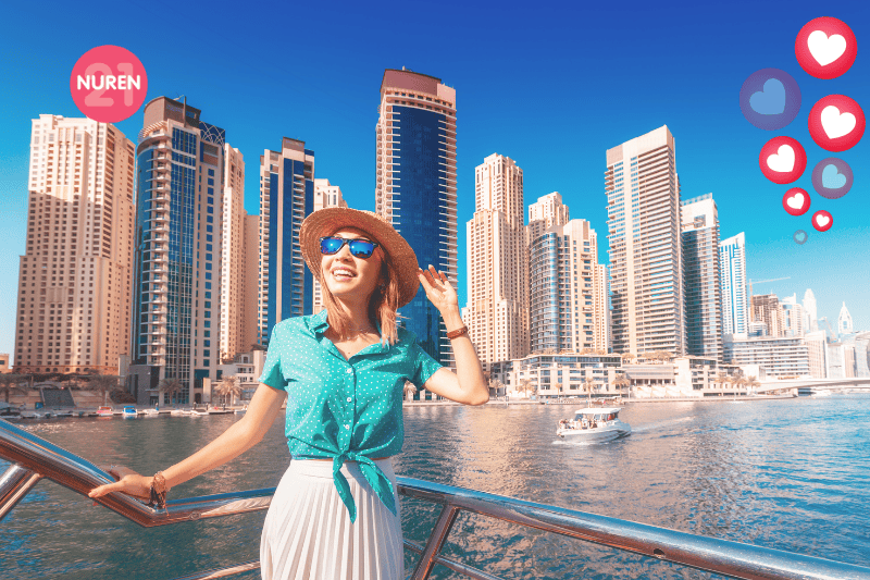 A woman on a ship near a city port