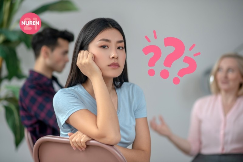 A woman thinking while surrounded by people