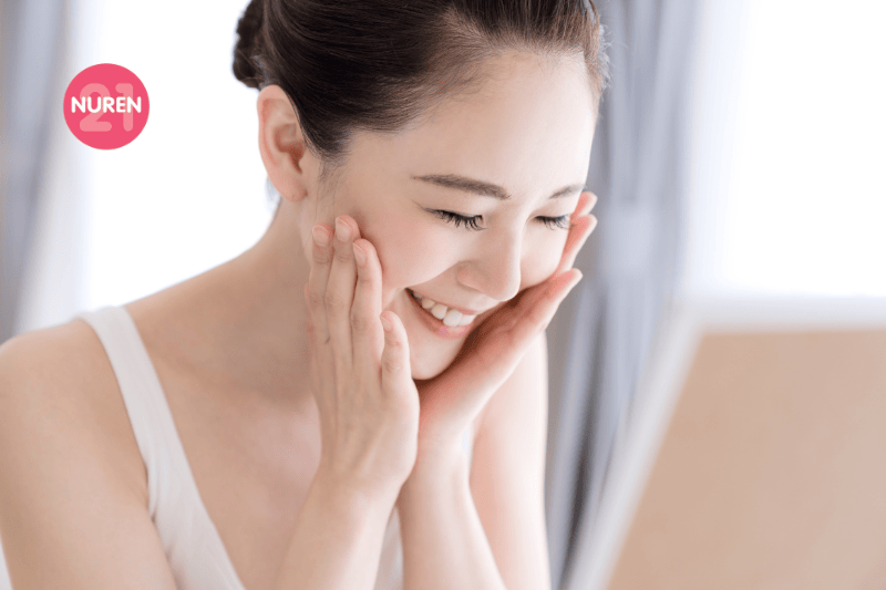 woman patting skincare on face for absorption