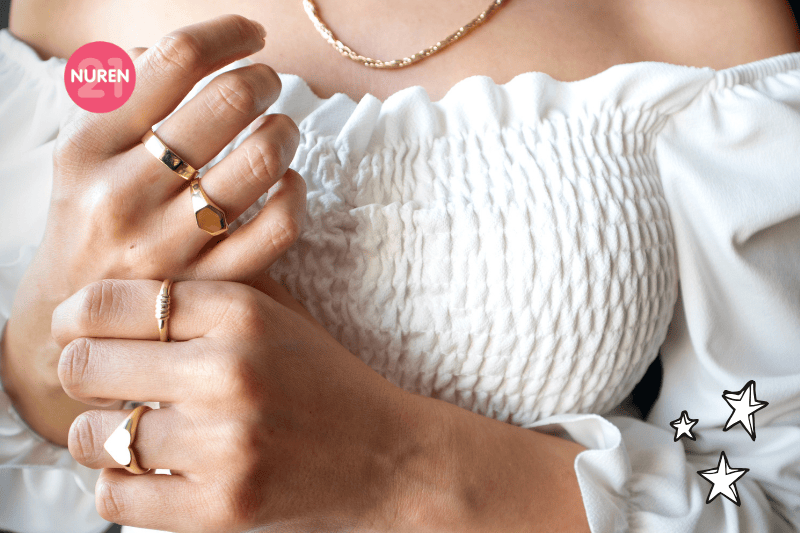 A jewellery model showing off more rings