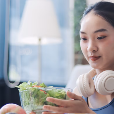 woman with headphone eating healthy meals active lifestyle