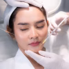 young Asian woman making cosmetology treatment skin injection, Mesotherapy of face beauty care