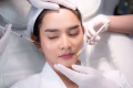 young Asian woman making cosmetology treatment skin injection, Mesotherapy of face beauty care