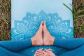 Women’s health. Female practicing yoga outdoors. Symbol of feminine health, fertility and healthy lifestyle. Concept of Holistic wellbeing, maternity, sustainable lifestyle, gynecology.