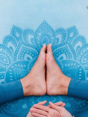 Women’s health. Female practicing yoga outdoors. Symbol of feminine health, fertility and healthy lifestyle. Concept of Holistic wellbeing, maternity, sustainable lifestyle, gynecology.